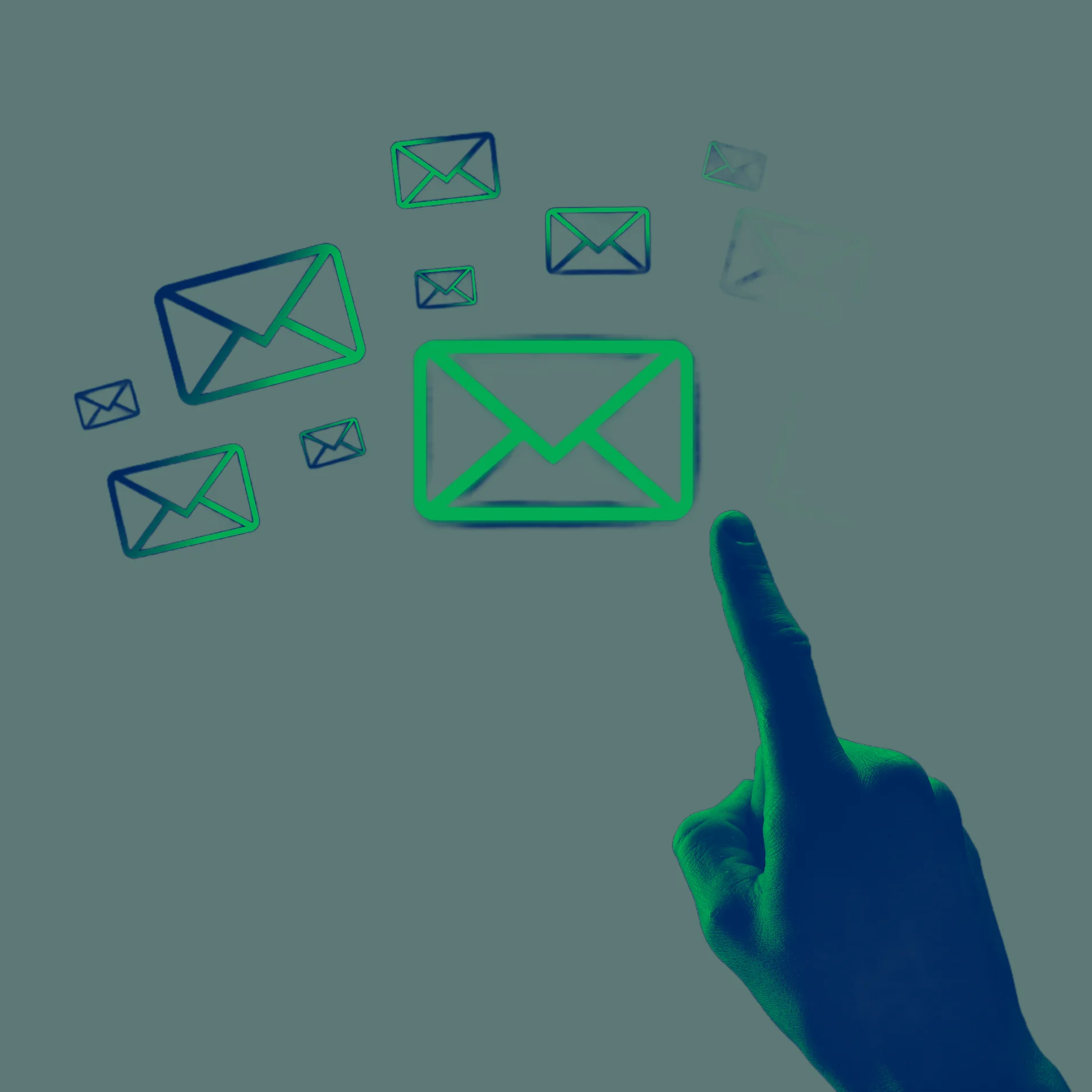 Person's hand pointing at email symbols floating into space