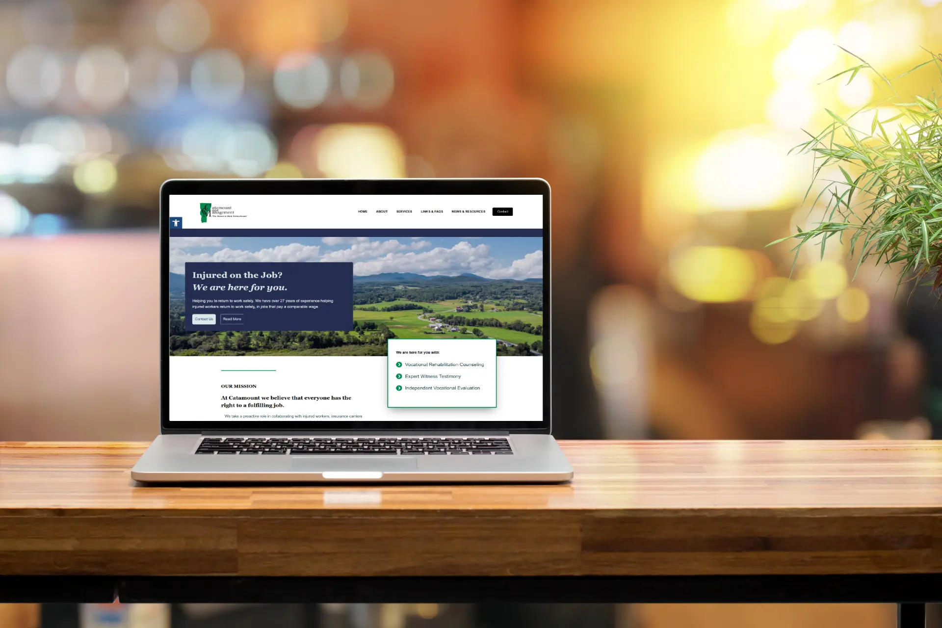 Catamount Case Management website image inside laptop and mobile phone